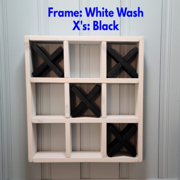 Tic Tac Toe Bathroom Shelf White with Black Xs hanging on wall