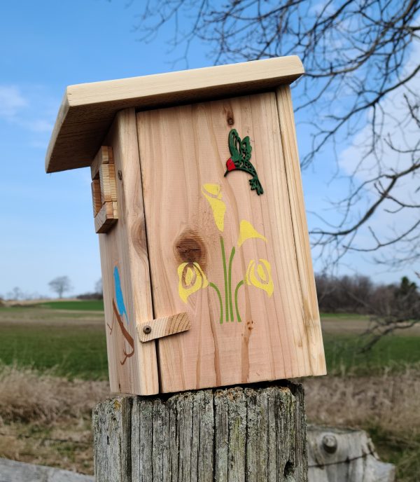 Birdhouse showing side panel that tilts in the closed position