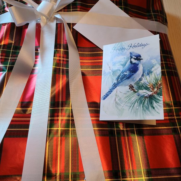 Sample of Gift Wrapped Product in Red Plaid Paper with White Ribbon and Card.