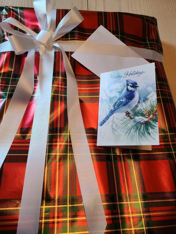 Sample of Gift Wrapped Product in Red Plaid Paper with White Ribbon and Card.