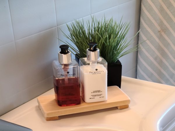 Wood Riser decorated with 2 pump soap bottles